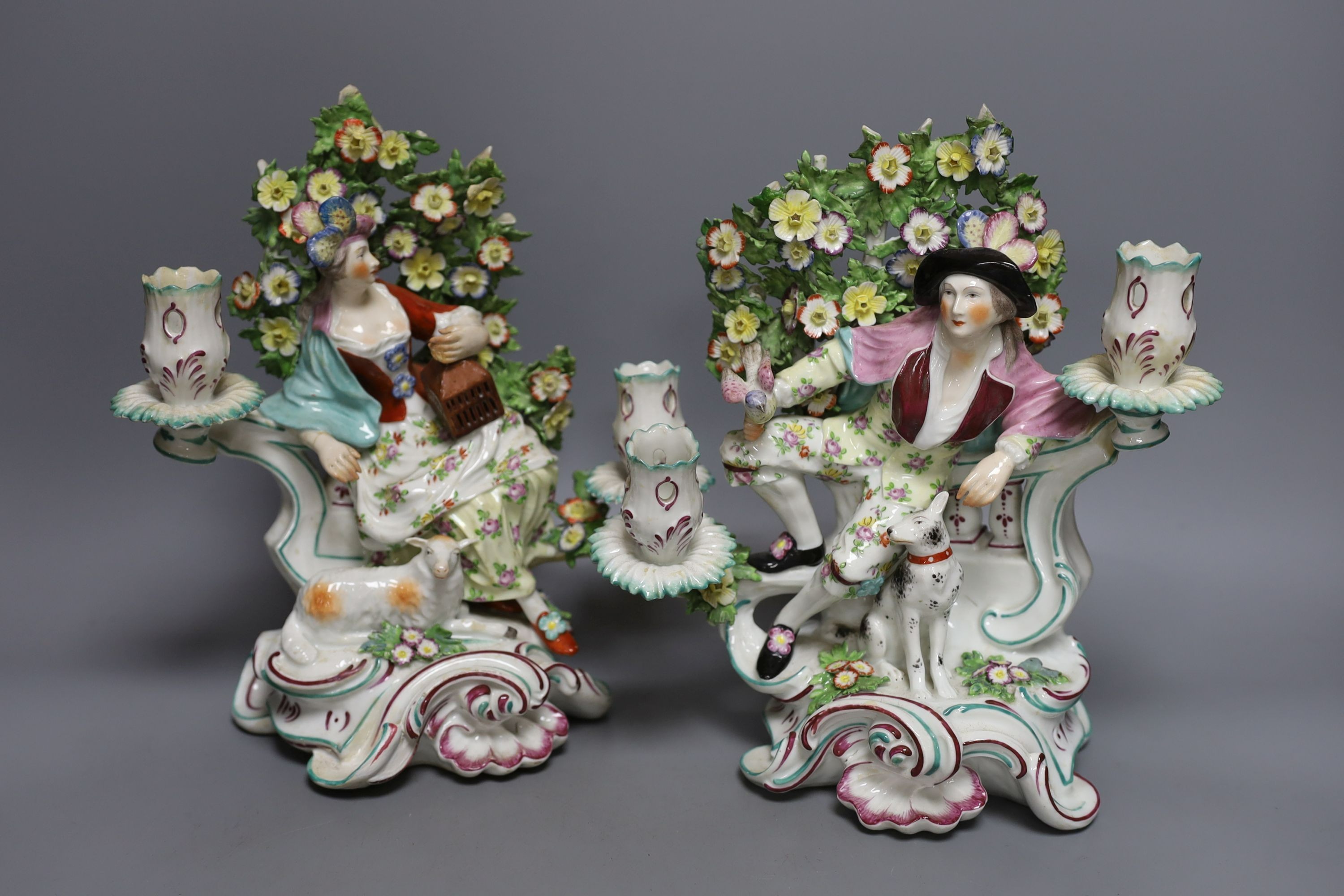 A pair of Chelsea Derby twin sconce candelabra figures, c.1770 - 28cm tall